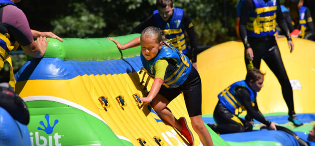 Kids on an inflatable obstacle course