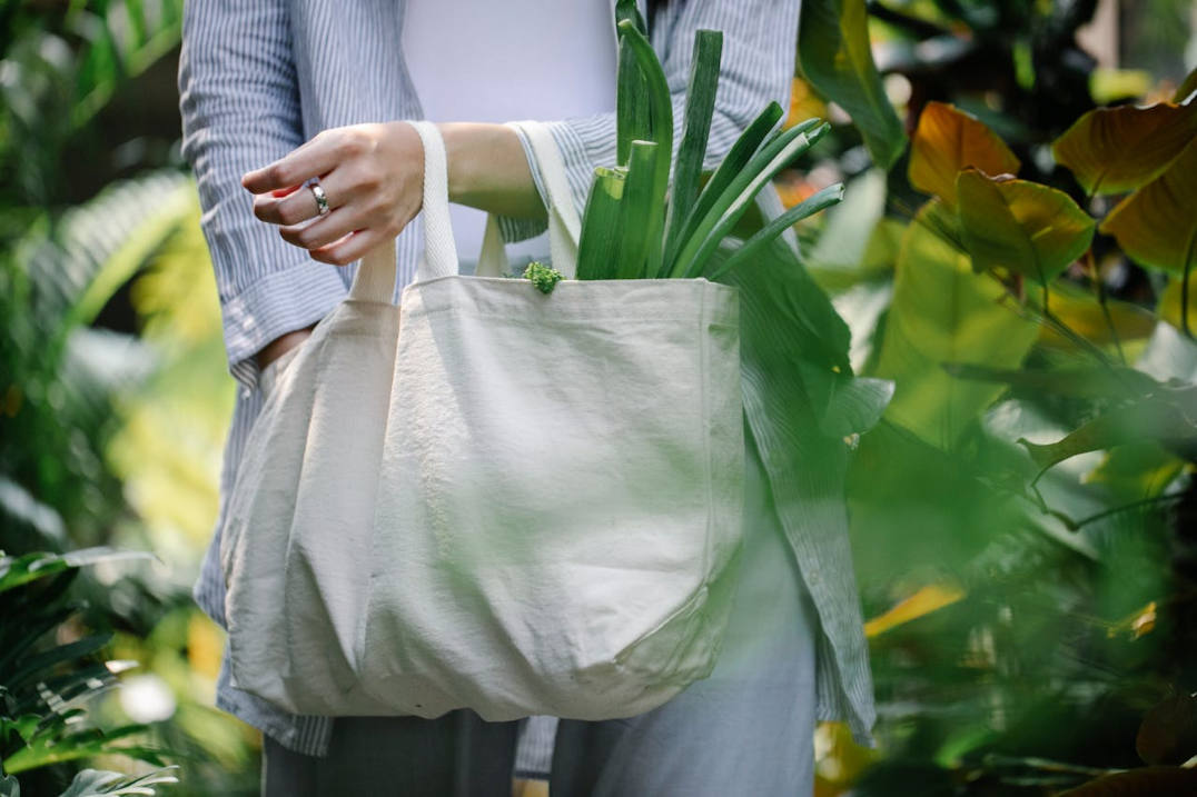 Woman shopping with a reusable canvas bag