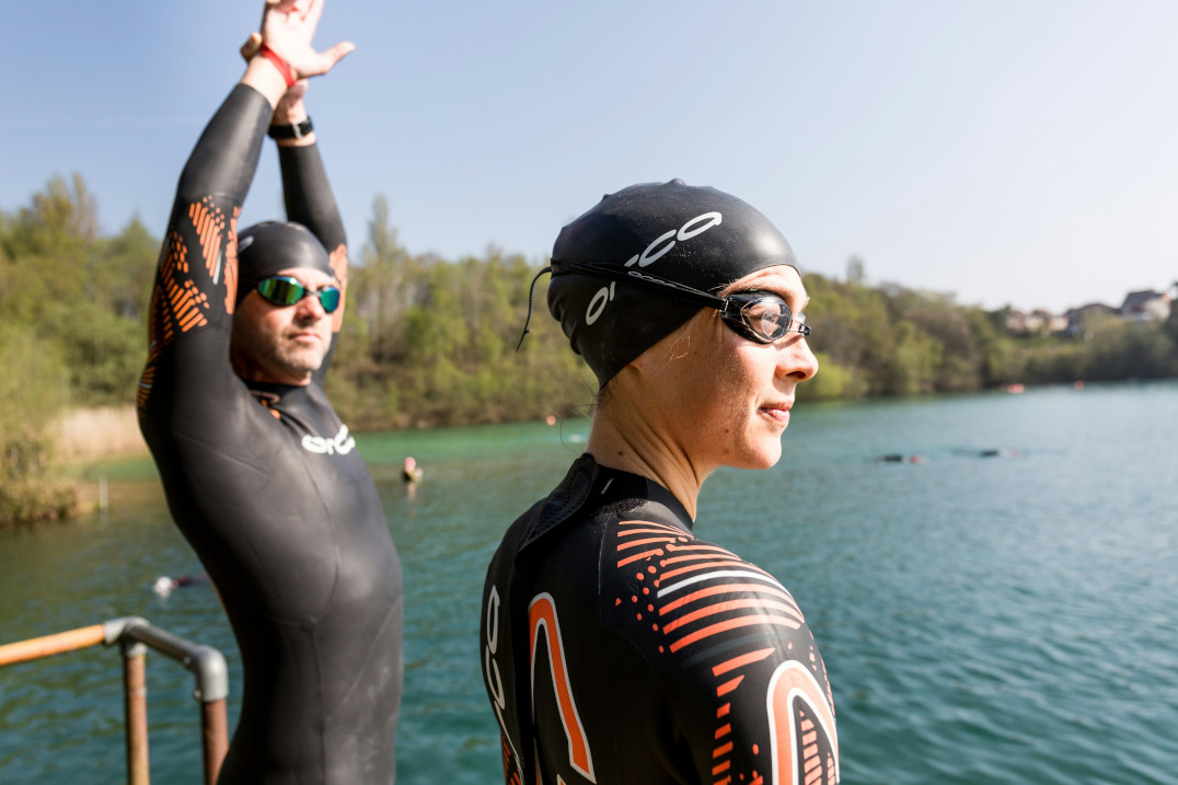 A pair of wild swimmers about to dive into the lake