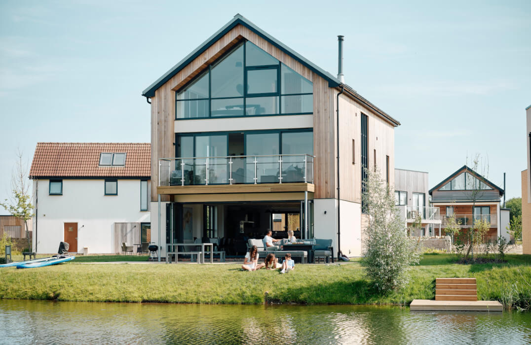 Family spending time together in their lakeside holiday home at Silverlake