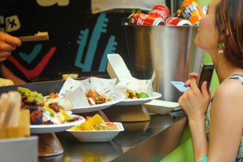 A girl buying food from a food stall