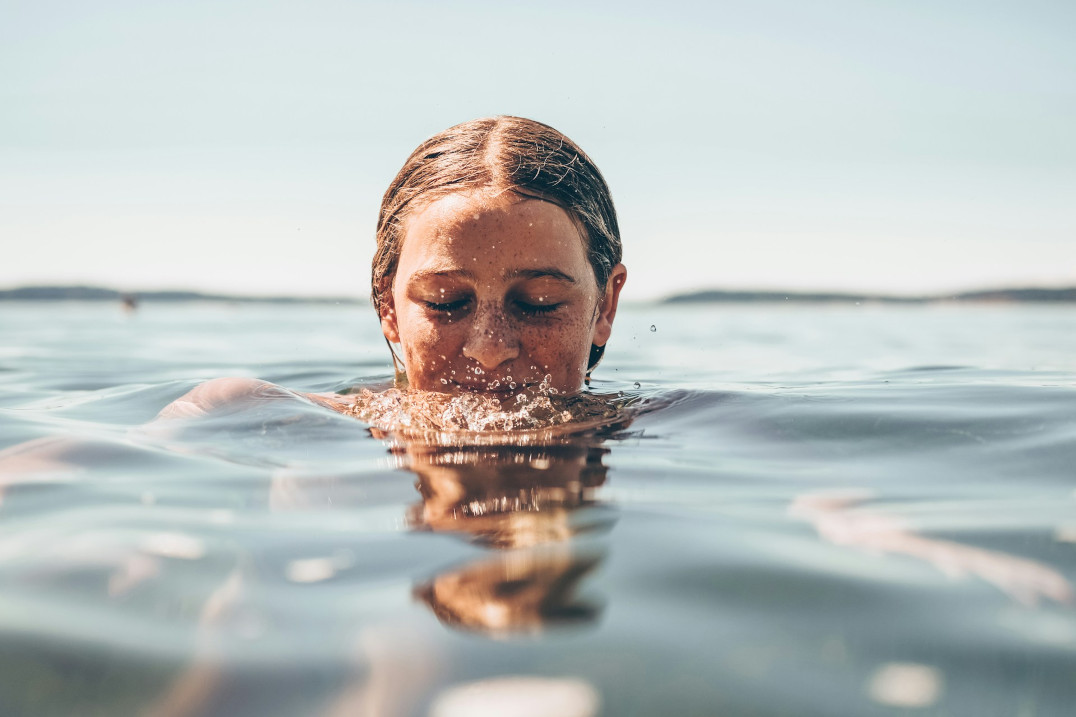 A woman paddling in the sea