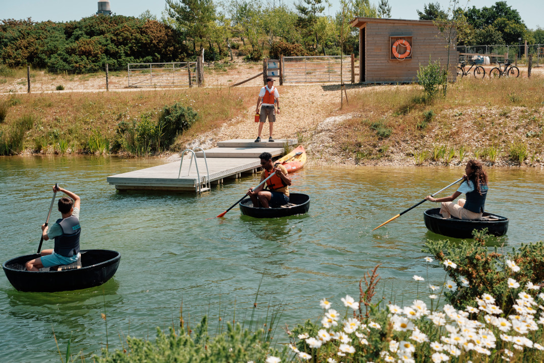 A group paddling on a lake